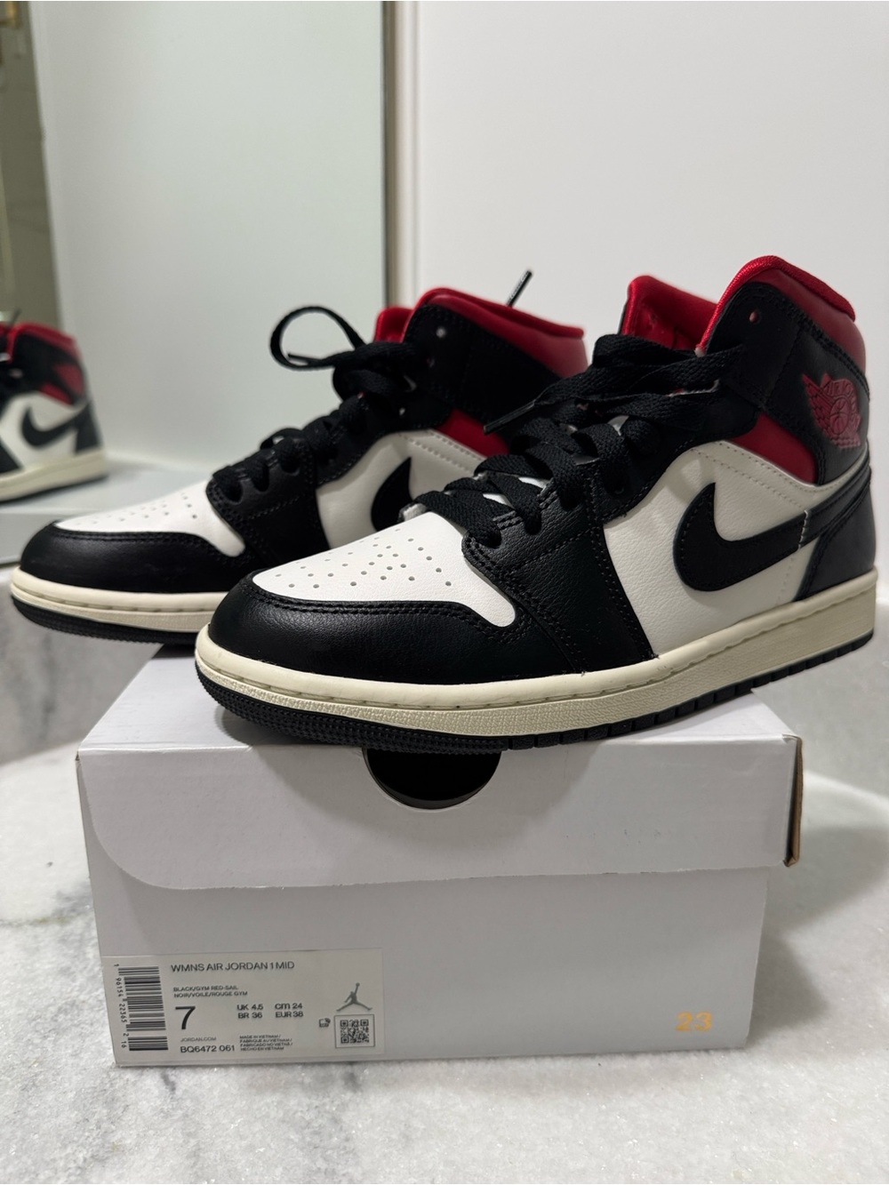 Nike Air Jordan 1 Mid in White, Black & Red